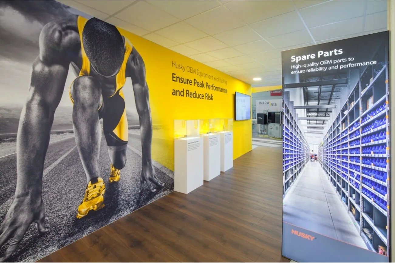 OEM parts marketing wall featuring sprinter imagery and spare-parts display