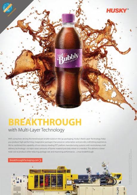 Husky magazine advertisement showing a purple-labelled drink bottle surrounded by splashing liquid, with a Multi-Layer Technology message and injection moulding equipment below
