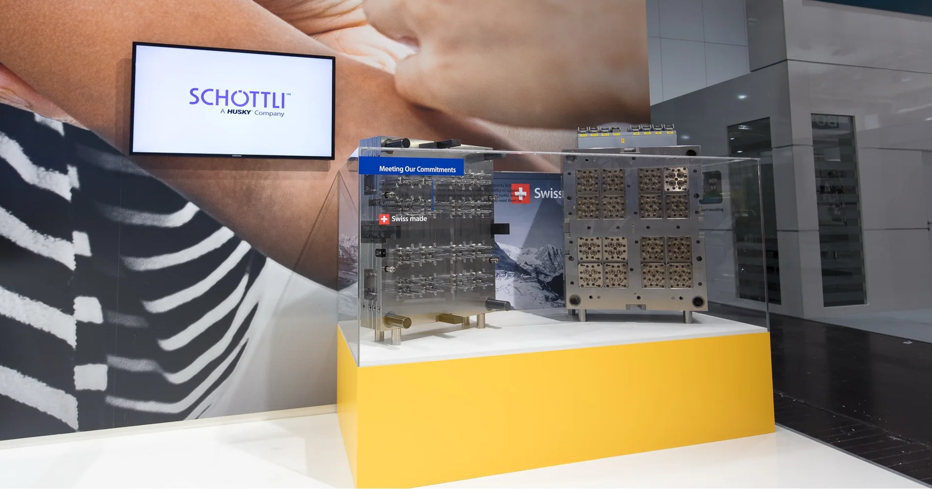 Schöttli tooling demonstration beneath Husky acquired-company brand