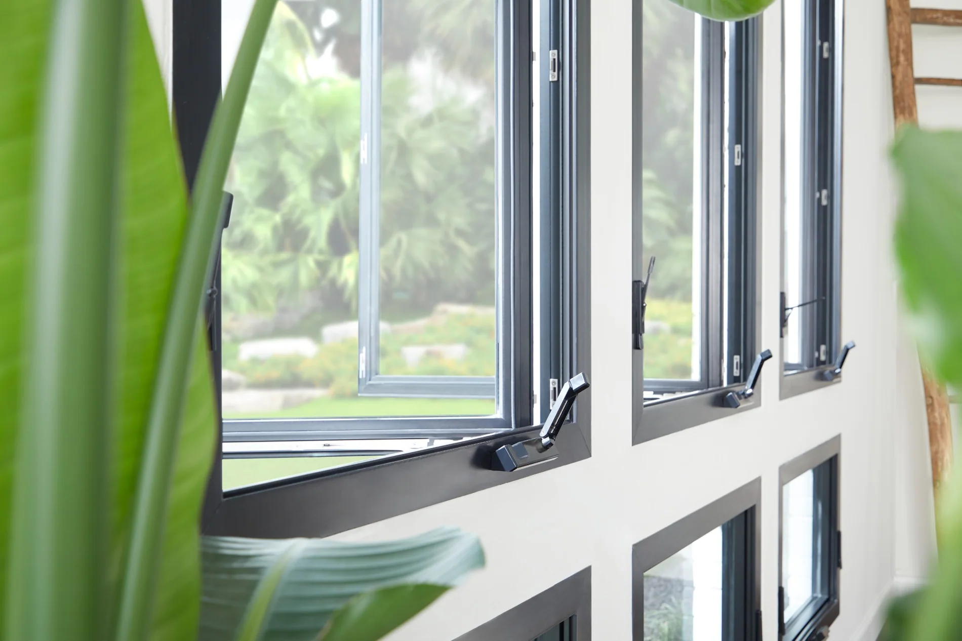 Black casement windows open in bright contemporary residential interior